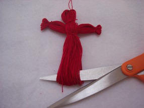 Use sharp scissors to trim your crochet thread angel ornament