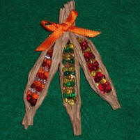 Craft an Indian corn pin from beads to help celebrate your Thanksgiving holiday gathering.