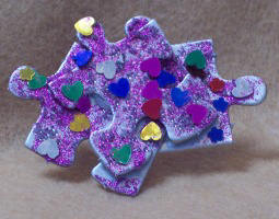 learn to make a pin from recycled puzzle pieces - free craft instructions for this easy kids craft project