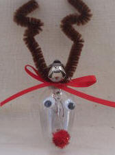 Reindeer ornament crafted from recycled night ligth bulb and pipecleaner