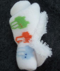 complete rose bud made from a baby sock